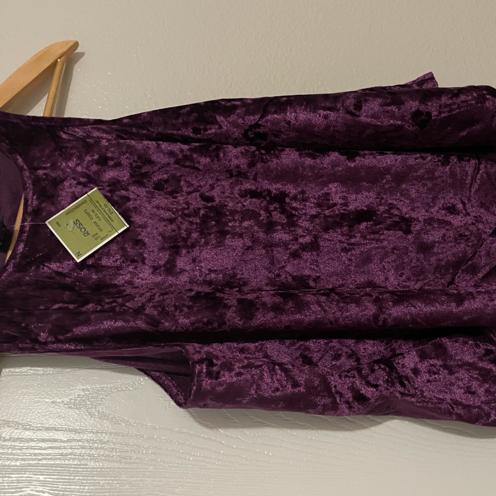 Plum /purple color, cute tank top never worn. Velvet material